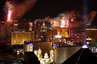 New Year’s Eve fireworks explode over the Las Vegas Strip just after midnight Friday, Jan. 1, 2016.