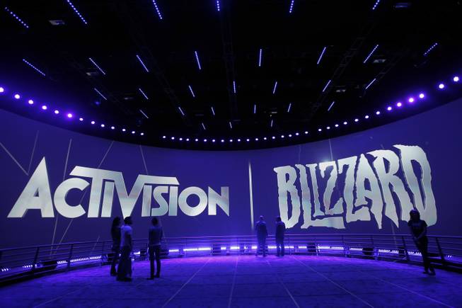 This June 13, 2013, file photo shows the Activision Blizzard Booth during the Electronic Entertainment Expo in Los Angeles. "Call of Duty" publisher Activision Blizzard Inc. is buying Major League Gaming in a bid to push deeper into e-sports. The video maker announced plans Monday, Jan. 4, 2016, to purchase the 12-year-old competitive gaming organization.