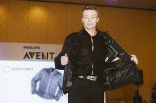A model walks down the runway at a FashionWare show during CES at the Venetian on Jan. 7, 2016.  He is wearing the SCOTTeVEST, a 30-pocket jacket that can hold up to a full-size laptop.