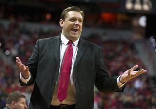 UNLV interim head coach Todd Simon is pleased as his team keeps their lead late over New Mexico at the Thomas & Mack Center on Tuesday, January 12, 2016.