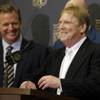 NFL Commissioner Roger Goodell, left, laughs as Oakland Raiders owner Mark Davis talks to the media after an NFL owners meeting Tuesday, Jan. 12, 2016, in Houston.