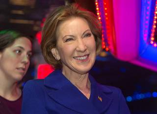 Republican presidential candidate Carly Fiorina, right, waits as she is introduced during a coffee meet and greet at the Peppermill Fireside Lounge Monday, Jan. 18, 2016.