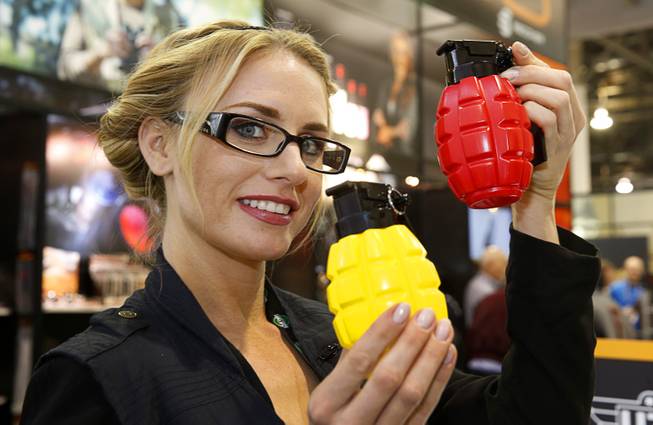 Tana Twet-Meister displays prototype mustard and ketchup containers at the Campco booth during the SHOT (Shooting, Hunting and Outdoor Trade) Show at the Sands Expo Tuesday, Jan. 19, 2016.