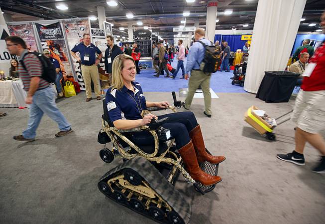 Megan Putze rides in an Action Trackchair during the SHOT (Shooting, Hunting and Outdoor Trade) Show at the Sands Expo Tuesday, Jan. 19, 2016.