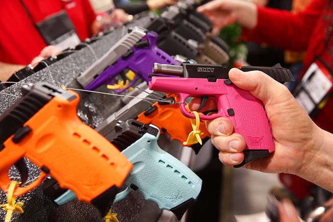 SCCY handguns in 9 different colors are displayed during the SHOT (Shooting, Hunting and Outdoor Trade) Show at the Sands Expo Tuesday, Jan. 19, 2016.