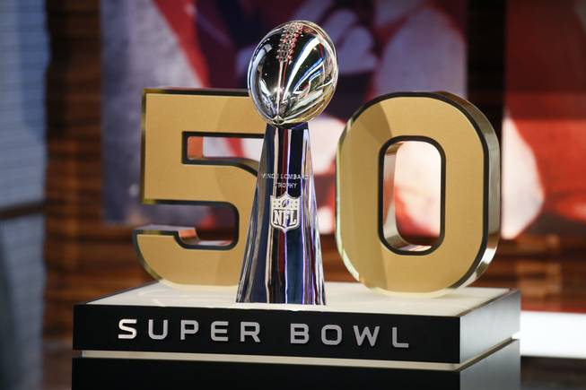 The Vince Lombardi Trophy in front of the No. 50, the number of the Super Bowl in February, at NFL Network studios Wednesday, Sept. 9, 2015, in Culver City, Calif. Cox Communications subscribers in Las Vegas won't be able to watch the game on TV if the cable provider and KLAS don't reach an agreement on their contract, which expires Jan. 29.