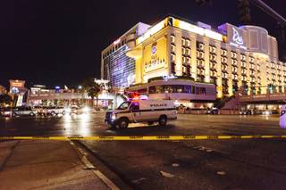 Metro Police officers block Las Vegas Boulevard South at Flamingo Road at the scene of an officer-involved shooting on Friday, Jan. 22, 2016. The boulevard was closed between Flamingo and the Paris resort as officers investigated.