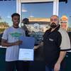 Carl Crayon of Eldorado High is the Wingstop Player of the Week. He's pictured with Steve Shibly, the general manager of Wingstop on Nellis Blvd. and Stewart Avenue.