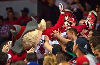 UNLV mascot Hey Reb surfs the crowd while facing San Diego State during their game at the Thomas & Mack Center on Saturday, January 30, 2016.