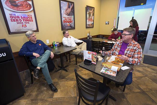 Cameron Cummins, left, chief development officer of Marco's Pizza, and Bryon Stephens, president and COO, listen to customer Robert Goetz in the Marco's Pizza at 3400 S. Hualapai Way Thursday, Feb. 4, 2016. Stephens recently appeared on the CBS show "Undercover Boss."  Goetz decided to try out the pizza after watching Stephens on the television show, he said.