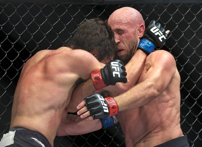 Lightweight KJ Noons smashes his head into the nose of Joshua Burkman during their UFC Fight Night 82 match at the MGM Grand Garden Arena on Saturday, February 6 2016.  L.E. Baskow