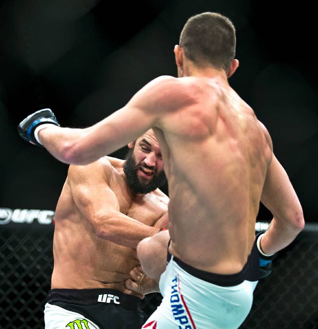 Welterweight Johny Hendricks takes a kick to the stomach from Stephen Thompson during their UFC Fight Night 82 match at the MGM Grand Garden Arena on Saturday, February 6 2016.  L.E. Baskow