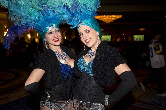 Melanie Kramer, left, and Sarah Jane Woodall pose during the Westgate's Pigskin Party Sunday, Feb. 7, 2016.