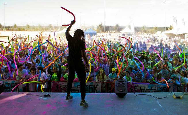 DJ tantrum pumps up the crowd of runners celebrating about the stage following the Las Vegas Color Vibe 5K run at Craig Ranch Park on Saturday, February 6 2016.  A portion of the proceeds from the event will benefit the Nevada Childhood Cancer Foundation.  L.E. Baskow