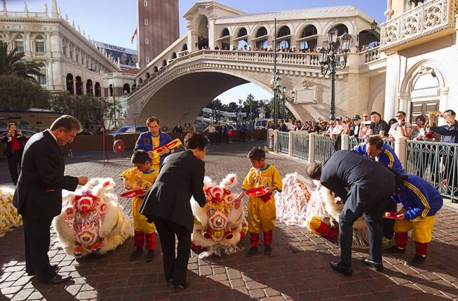 George Markantonis, left, president/COO of the Venetian/Palazzo and Sands Expo, Mia Banks, center, vice president of casino operations, center, and Pete Boyd, senior vice president of operations, take part in Chinese New Year celebrations at the Venetian and Palazzo Monday, Feb. 8, 2016. The Chinese New Year, the Year of the Monkey, began Monday.