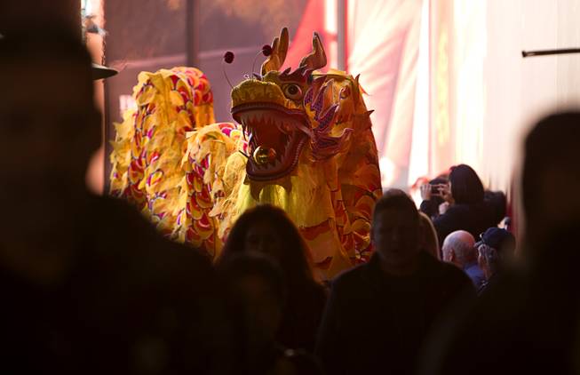 Dragon dancers make their way toward the Venetian lobby during Chinese New Year celebrations at the Venetian and Palazzo Monday, Feb. 8, 2016. The Chinese New Year, the Year of the Monkey, began Monday.