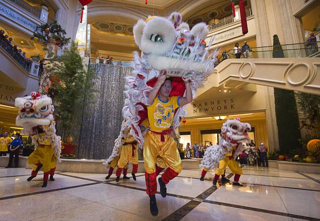 Lion dancers perform in the Waterfall Atrium and Gardens of The Palazzo during Chinese New Year celebrations Monday, Feb. 8, 2016. The Chinese New Year, the Year of the Monkey, began Monday.