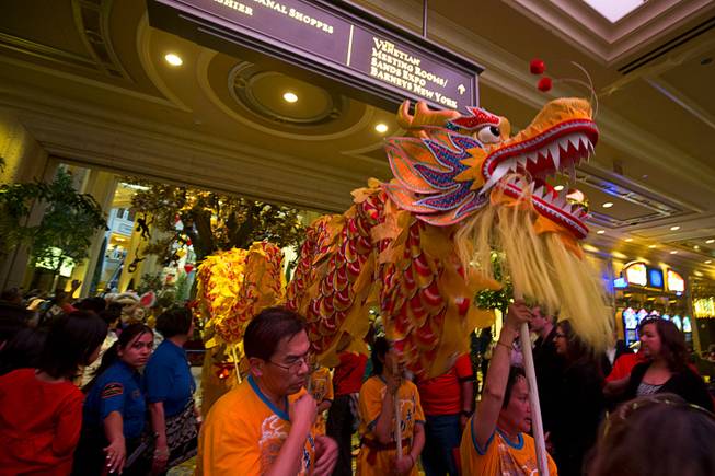 Dragon dancers head onto the casino floor of the Palazzo during Chinese New Year celebrations Monday, Feb. 8, 2016. The Chinese New Year, the Year of the Monkey, began Monday.
