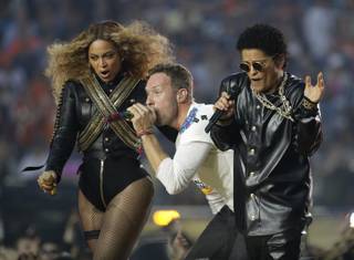 Beyonce, Coldplay singer Chris Martin and Bruno Mars perform during halftime of Super Bowl 50 on Sunday, Feb. 7, 2016, in Santa Clara, Calif.