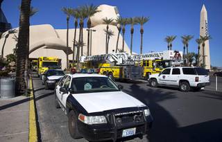 Metro Police and Clark County Fire Department vehicles are staged in front of the Luxor Wednesday, Feb. 10, 2016. Three floors of the resort have been evacuated while hazardous materials teams investigate a substance found in an unoccupied room, officials said.