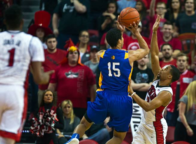 San Jose State guard Brandon Clarke (15) posts up for a shot under tight defense by UNLV guard Jerome Seagears (2) at the Thomas & Mack Center on Wednesday, February 10, 2016.