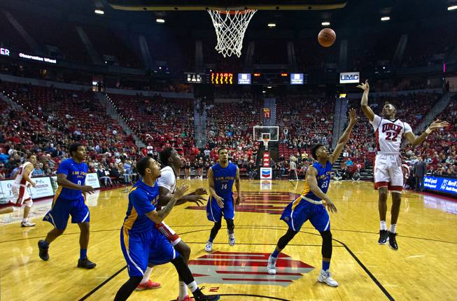 UNLV guard Patrick McCaw (22) posts up for a shot over San Jose State guard Princeton Onwas (23) and others at the Thomas & Mack Center on Wednesday, February 10, 2016.
