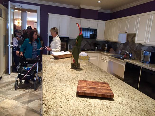Visitors tour the Fisher House in North Las Vegas after a dedication ceremony on Thursday, Feb. 11, 2016. The Fisher House, which sits next to the VA Southern Nevada Healthcare System, will provide housing for families of military members and veterans receiving treatment locally.