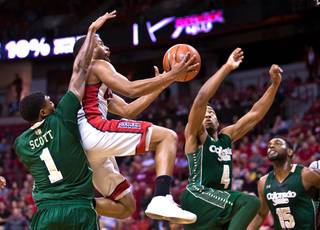 UNLV guard Jerome Seagears (2) slices through the  Colorado State defense for an acrobatic shot during their game at the Thomas & Mack Center on Saturday, February 13, 2016.
