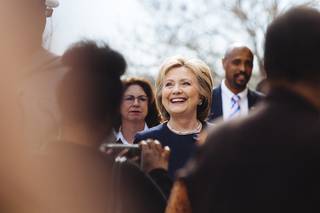 Democratic presidential candidate Hillary Clinton meets with people in front of a beauty school, Saturday, Feb. 13, 2016, in Las Vegas.