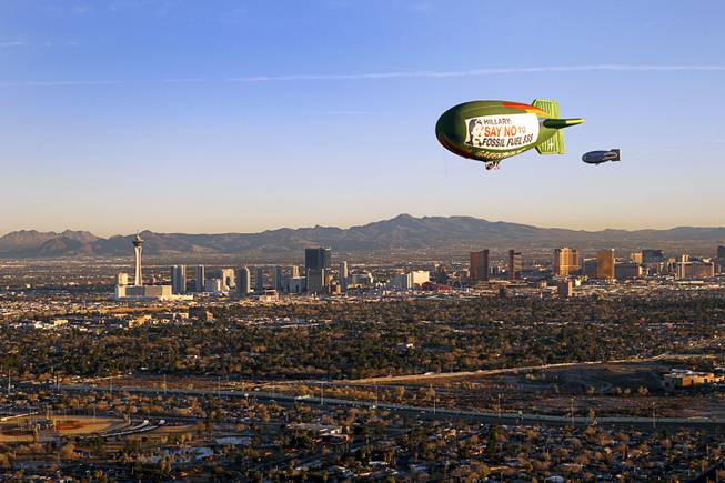 The Greenpeace A.E. Bates thermal airship flies over Las Vegas Tuesday, Feb. 16, 2016. Greenpeace is urging Democratic presidential candidate Hillary Clinton to sign a pledge that she will not to take money from the fossil fuel industry.