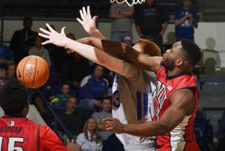 Air Force center Frank Toohey, and UNLV guard Ike Nwamu, right, go after a loose ball during the second half of an NCAA college basketball game Tuesday, Feb. 16, 2016, at Air Force Academy, Colo. Air Force defeated UNLV 79-74. 