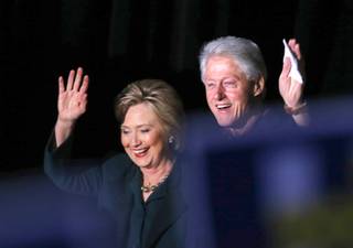 Democratic Presidential candidate Hillary Clinton and former President Bill Clinton arrive for a rally at the Clark County Government Center Friday, Feb. 19, 2016.
