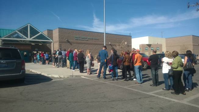 Caucusgoers line up at Grant Sawyer Middle School on Saturday, Feb. 20, 2016.