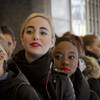 Guilia Dunes, 25, second from left, from Amsterdam, and Taylor Lewis, 22, center, from Baltimore, are lined up with other dancers outside Radio City Music Hall waiting to audition Tuesday, Feb. 23, 2016, for "Rockettes New York Spectacular." 