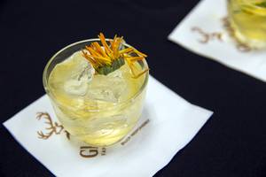 A "Deer in Headlights" cocktail is displayed during a gourmet 6-course dinner at Artisanal Foods Tuesday, March 1, 2016.