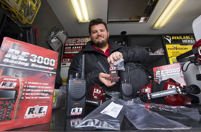 James Wallace of Race Electronics/FanVision shows off the "Black Package," a radio system that has a built-in wireless intercom so you can talk to your friends, during the Kobalt 400 NASCAR race at the Las Vegas Motor Speedway Sunday, March 6, 2016.