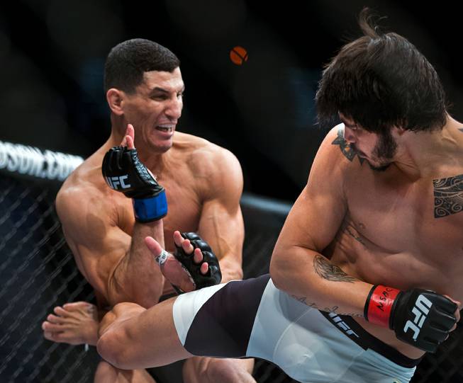 Welterweight Nordine Taleb absorbs a kick to the side from Erick Silva in their fight during UFC 196 from the MGM Grand Garden Arena on Saturday, March 5, 2016.