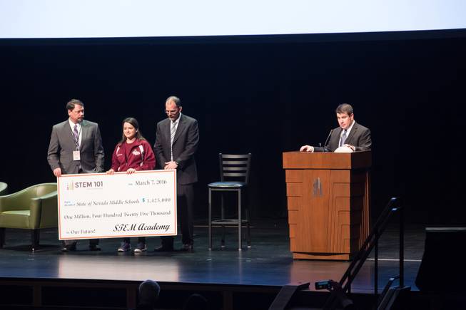 Dr. Alan Gomez, founder and chief academic officer of The STEM (Science, Technology, Engineering, Math) Academy, presents a $1.42 million check for Clark County School District middle schools during the 2016 Business Education Summit inside Rynolds Hall at The Smith Center, Monday March 7, 2016.