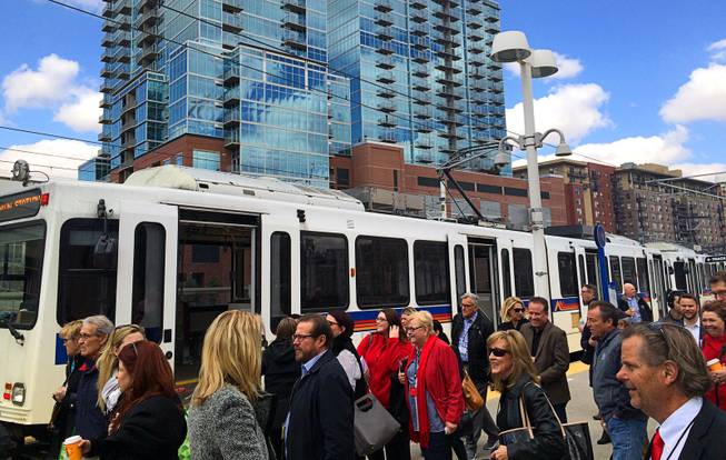 A view of travelers at the W light rail line at Union Station on Tuesday, March 8, 2016, in Denver.