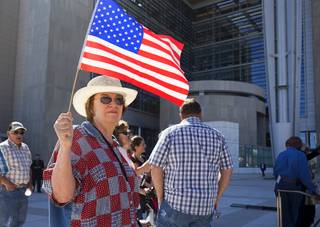Cathryn Adams and other supporters of Nevada rancher Cliven Bundy gather in front of the U.S. Courthouse in downtown Las Vegas Thursday, March 10, 2016. Bundy is facing charges relating to an armed ranching standoff against Bureau of Land Management agents in April 2014.
