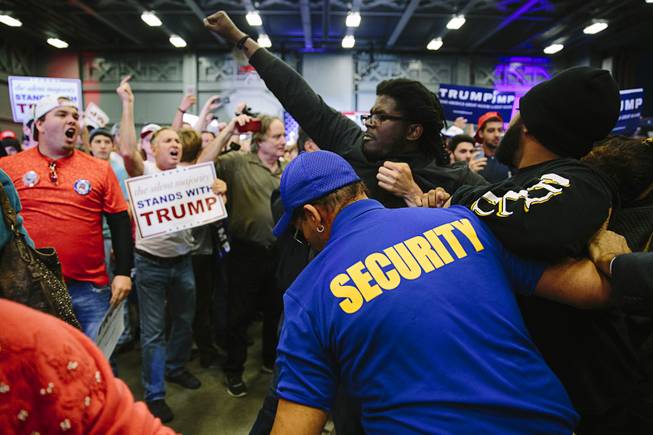 Protesters are ejected from a Donald Trump rally at Lakefront Airport in New Orleans, March 4, 2016. A number of the violent incidents at Trump’s raucous rallies have had racial overtones; on March 9, a black protester being escorted out was sucker-punched by an older white man, who on a later TV interview threatened to “kill him” next time. 