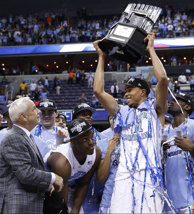 North Carolina forward Brice Johnson (11) holds the Championship trophy after an NCAA college basketball game in the championship of the Atlantic Coast Conference tournament against Virginia, Saturday, March 12, 2016, in Washington. North Carolina won 61-57.