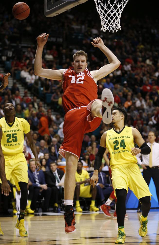 Utah forward Jakob Poeltl (42) comes down to the court after being fouled during the first half of the team's NCAA college basketball game against Oregon for the championship of the Pac-12 men's tournament Saturday, March 12, 2016, in Las Vegas.
