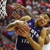 Weber State’s Joel Bolomboy pulls a rebound away from Arizona forward Rondae Hollis-Jefferson during the second half in a second-round game in the NCAA basketball tournament Friday, March 21, 2014, in San Diego.