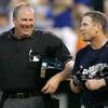 In this June 23, 2006, file photo, Milwaukee Brewers' Geoff Jenkins talks with home plate umpire Tim Welke after Jenkins grounded out during a baseball game against the Kansas City Royals in Kansas City, Mo. Welke is calling it a career after 33 seasons. 