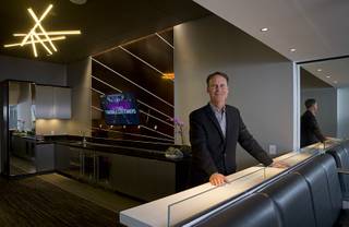 Mark Faber, senior vice president of global partnerships at AEG/T-Mobile Arena, poses in a mock-up of a Luxury Suite at the T-Mobile marketing center Monday, March 21, 2016.