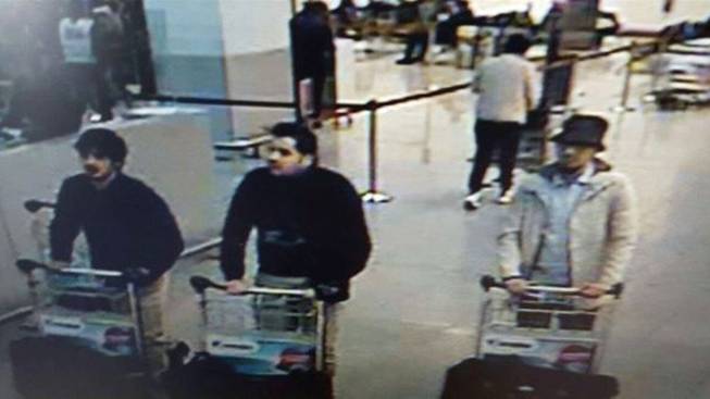 This image provided by Belgian Federal Police in Brussels on Tuesday, March 22, 2016, shows three men who are suspected of taking part in the attacks at Belgium’s Zaventem Airport. The man at right is still being sought by police, and two others in the photo were, according to Belgian prosecutors, “probably” suicide bombers.