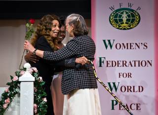 Dancer Dee Dee Jamin and Leslie Rigney embrace after exchanging roses during a Bridge of Peace ceremony at the Universal Peace Federation on Saturday, March 26, 2016. It was one of many events during the Las Vegas Peace Festival 2016 to commemorate the anniversary of 