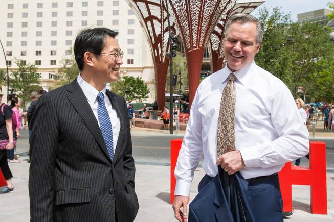 VP at Toshiba Fumio Otani and MGM CEO Jim Murren share a laugh during the T-Mobile Arena's opening day celebration, Wed. April 6, 2016.