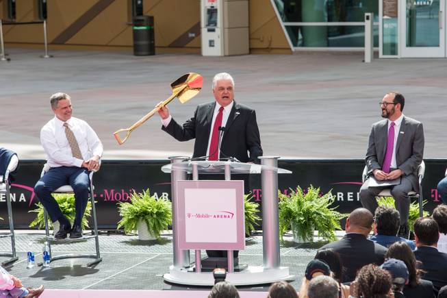 Clark County Commision Charman Steve Sisolak, holding  the same golden shovel he used during the groundbreaking ceramony two-years prior, makes a few remarks at a news conference Wednesday, April 6, 2016, during opening day of T-Mobile Arena on the Las Vegas Strip.